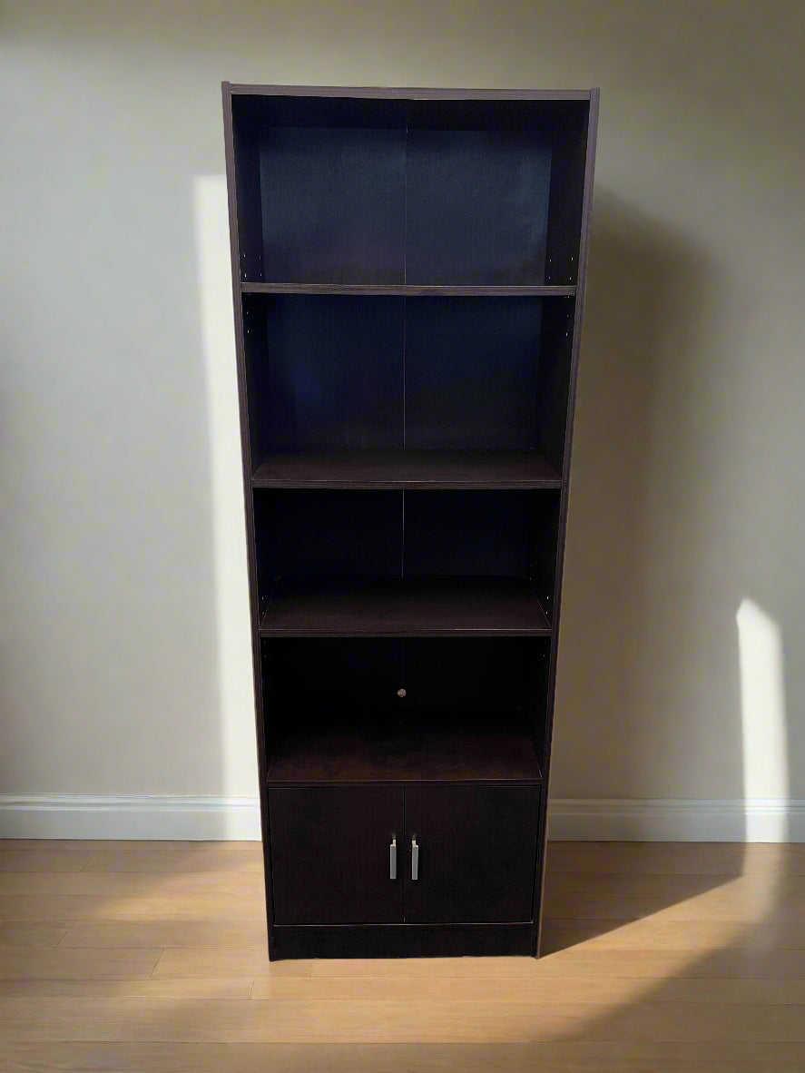 Dark brown bookshelf with a closed door against a plain wall.
