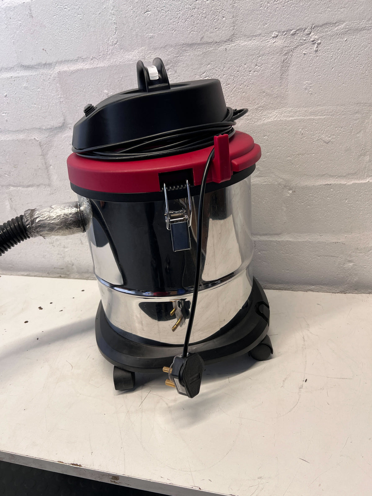 Stainless Steel Genesis Vacuum Cleaner with Red Accents