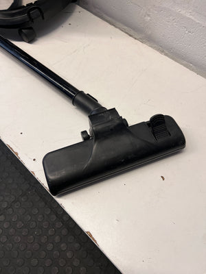 Stainless Steel Genesis Vacuum Cleaner with Red Accents