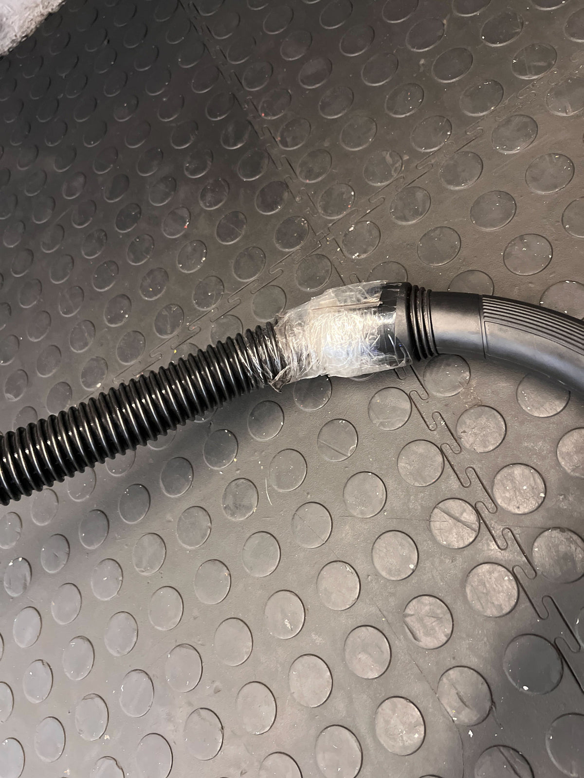 Stainless Steel Genesis Vacuum Cleaner with Red Accents