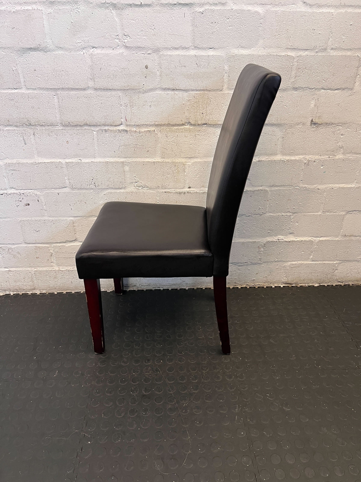 Elegant Black Leather Dining Chair with Cherry Wood Legs