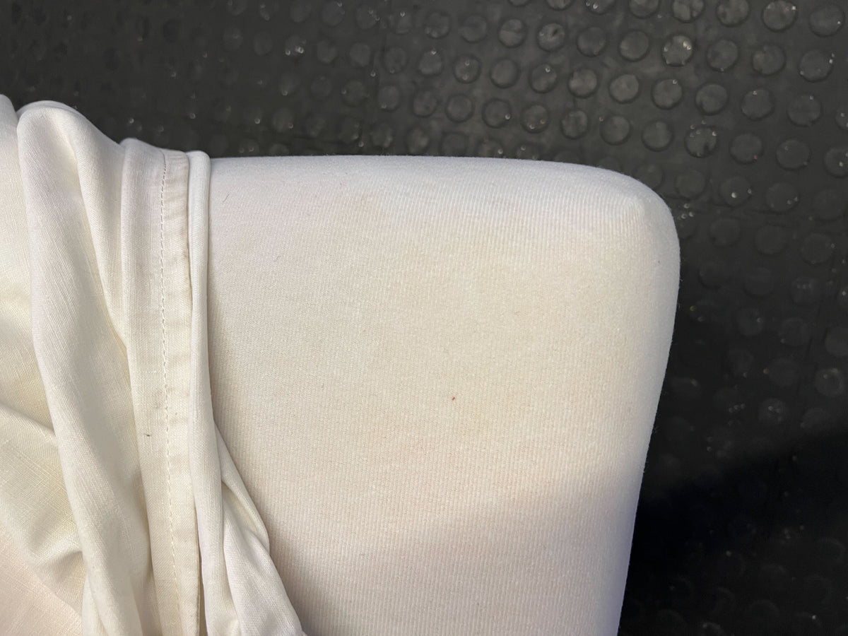 Elegant White Fabric Dining Chair with Minor Wear