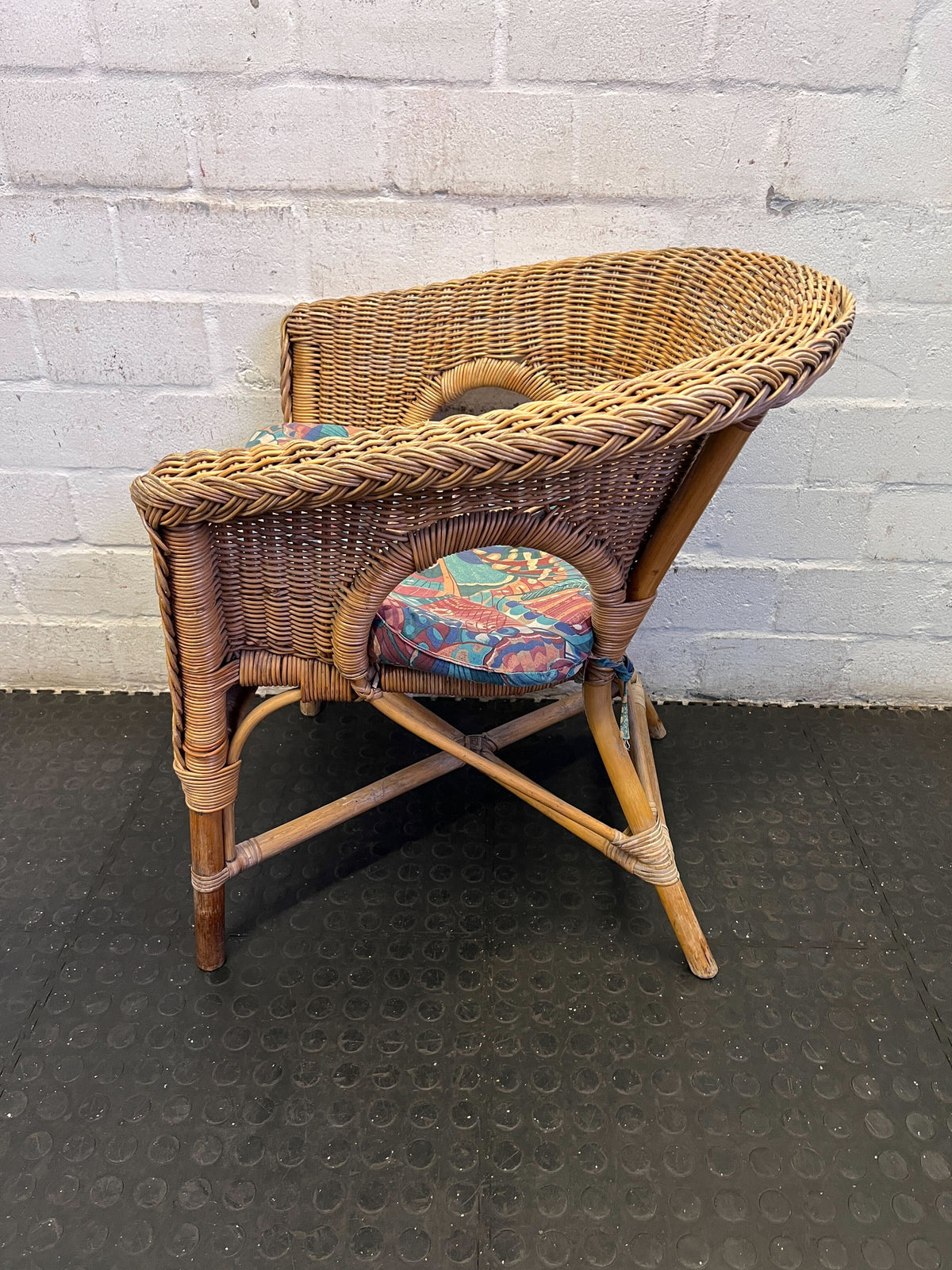 Charming Vintage Wicker Chair with Colorful Cushion