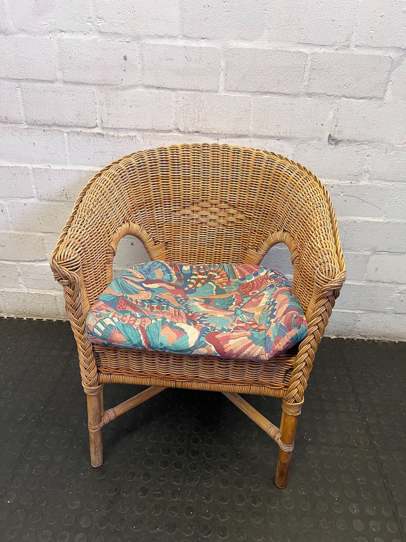 Charming Vintage Wicker Chair with Colorful Cushion
