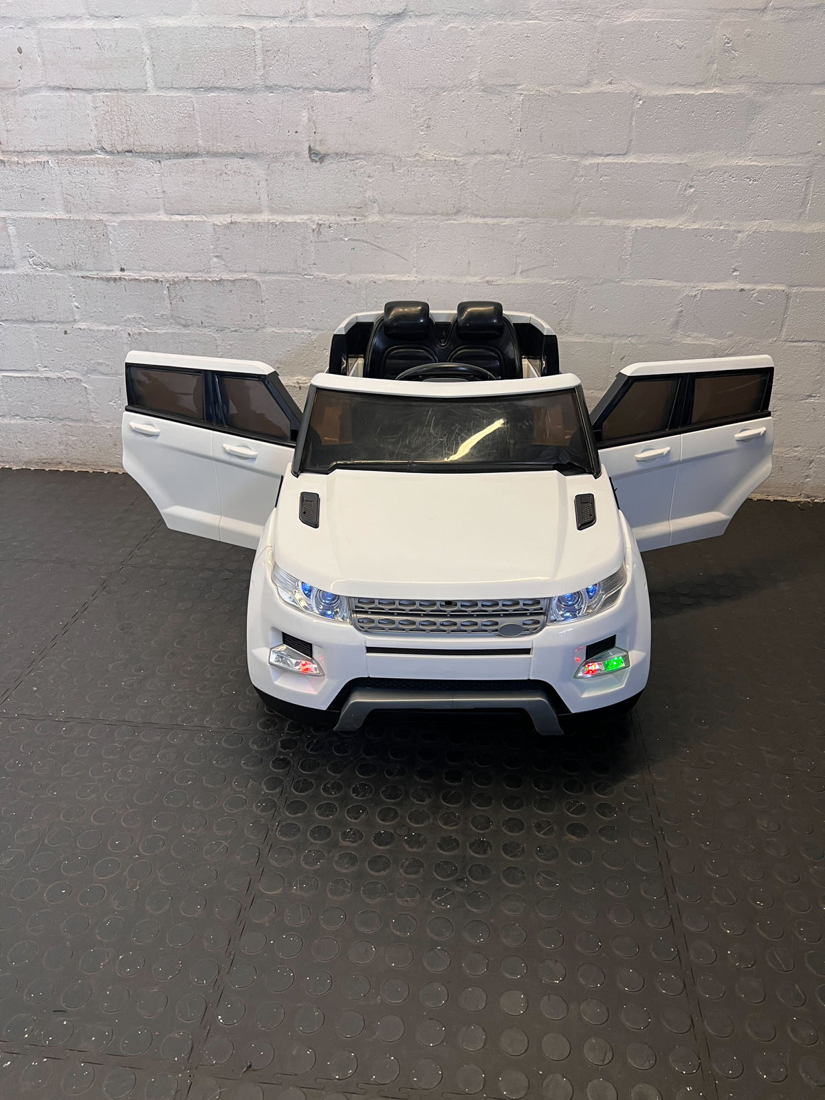 Pre-Loved White Ride-On Toy Car - Kids' Electric Adventure - Has No Remote Battery needs replacement