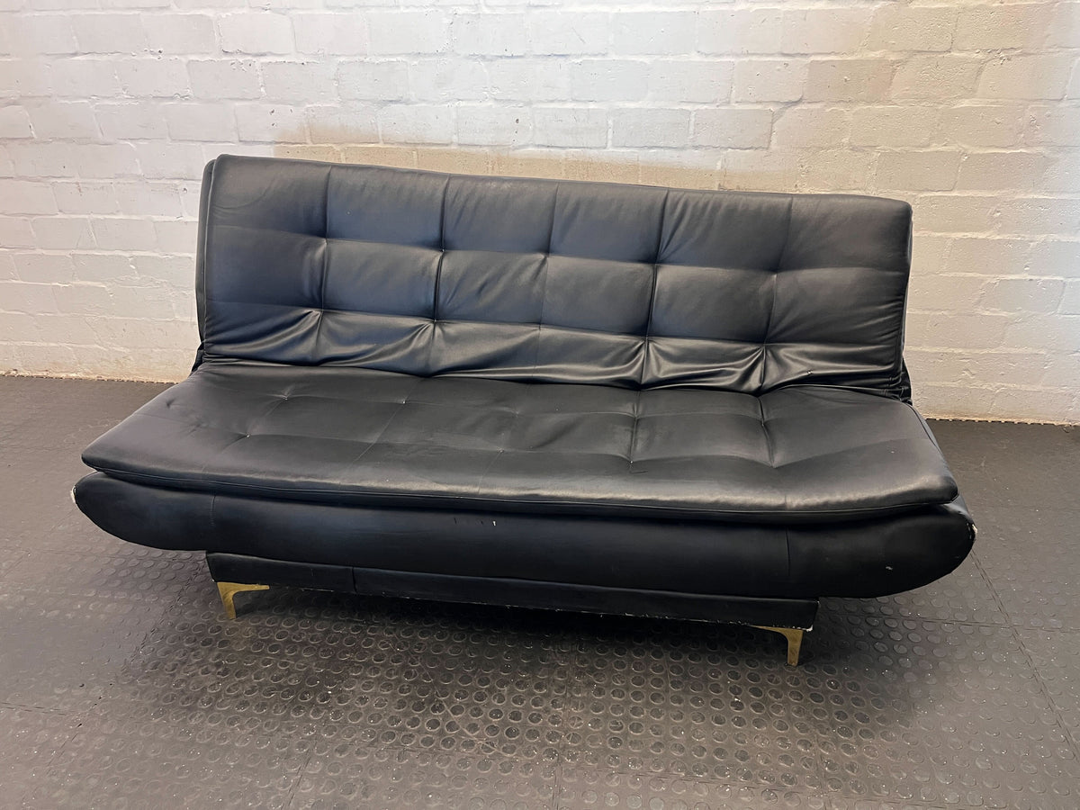 Versatile Black Faux Leather Futon Sofa Bed with Gold Accents - Broken one side - 2ndhandwarehouse.com