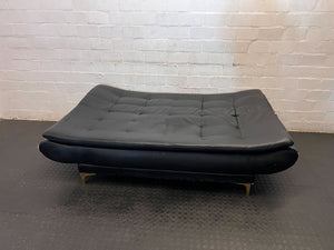 Versatile Black Faux Leather Futon Sofa Bed with Gold Accents - Broken one side - 2ndhandwarehouse.com