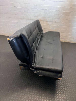 Versatile Black Faux Leather Futon Sofa Bed with Gold Accents - Broken one side - 2ndhandwarehouse.com