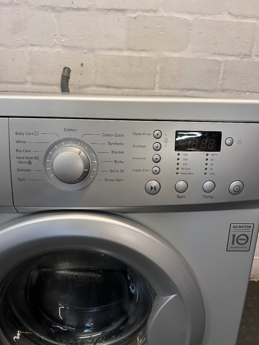 LG 7kg Front Loader Washing Machine in Silver — Good Working Order with Minor Scratches - 2ndhandwarehouse.com