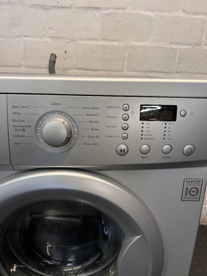 LG 7kg Front Loader Washing Machine in Silver — Good Working Order with Minor Scratches - 2ndhandwarehouse.com