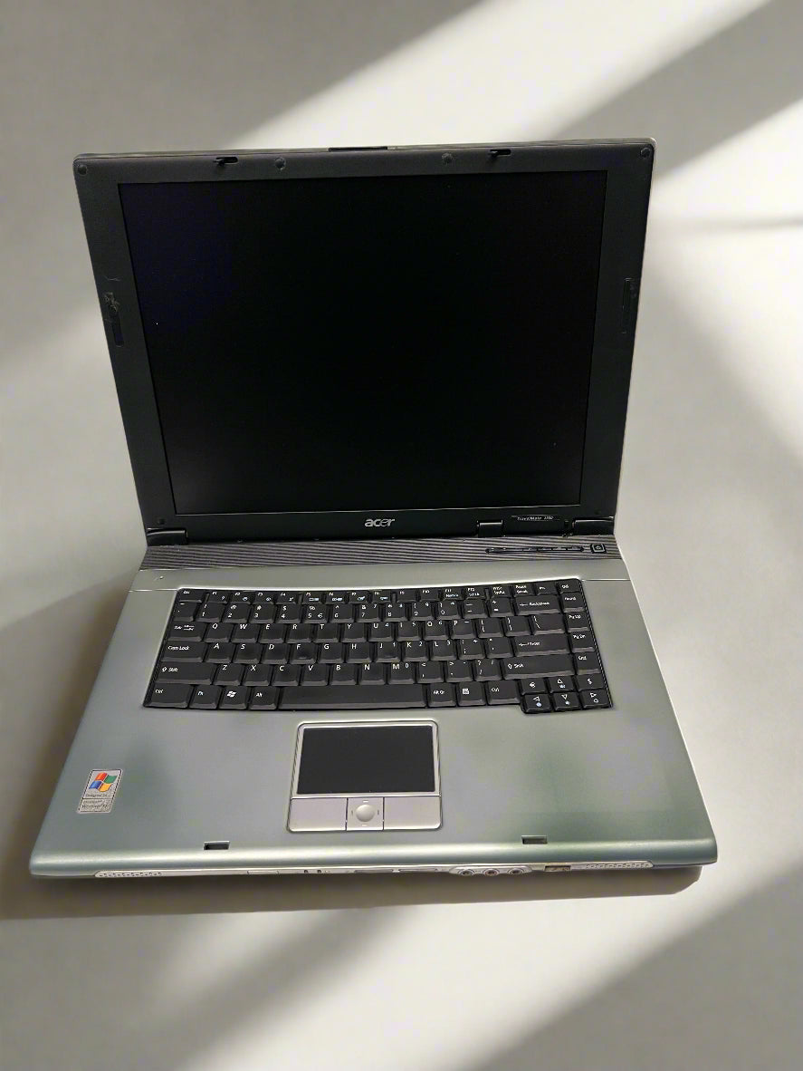Open laptop on a light surface with Acer branding