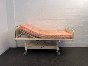 Adjustable Hospital Single Bed with Orange Floral Mattress on Wheels (Slightly Stained)