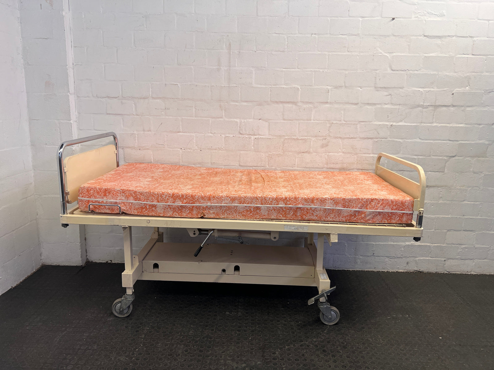 Adjustable Hospital Single Bed with Orange Floral Mattress on Wheels (Slightly Stained) - REDUCED