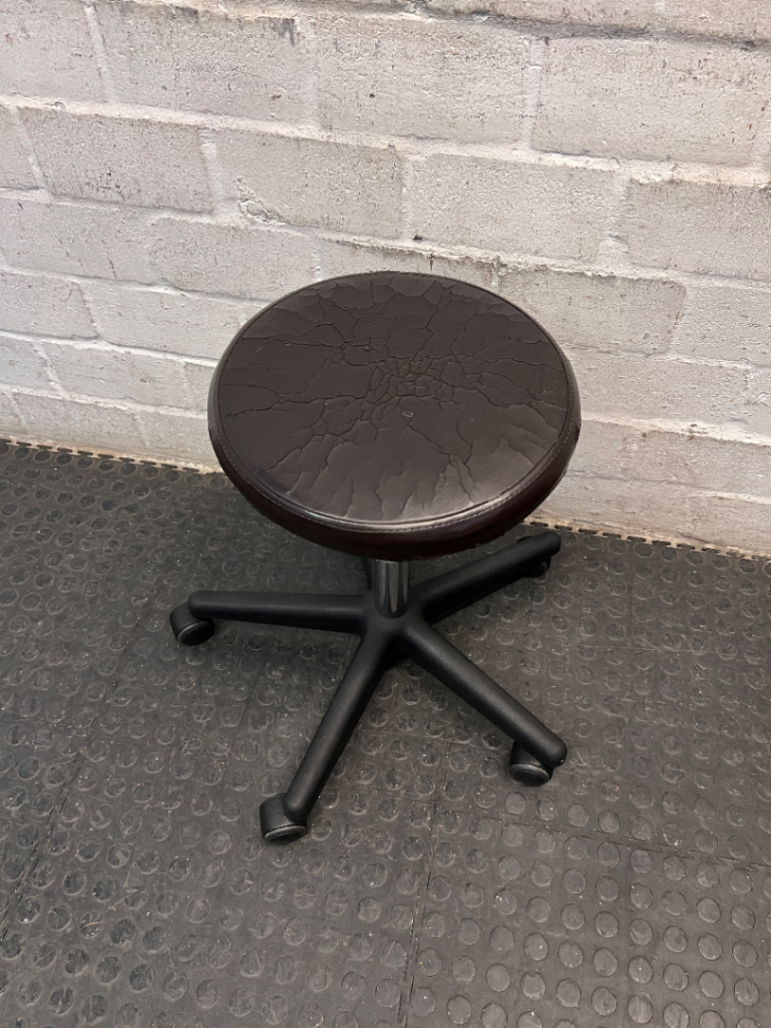 Adjustable Swivel Stool with Castors in Brown — Cracked and Peeling Seat Surface