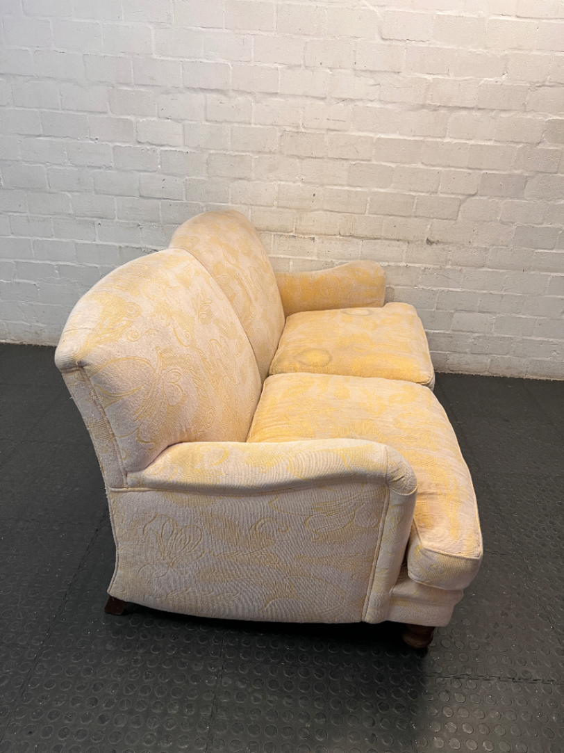 Beige Floral Patterned 2 Seater Couch with Wooden Feet — Fair Condition with General Wear