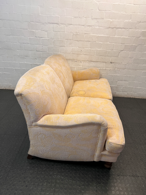 Beige Floral Patterned 2 Seater Couch with Wooden Feet — Fair Condition with General Wear