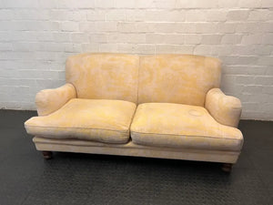 Beige Floral Patterned 2 Seater Couch with Wooden Feet — Fair Condition with General Wear