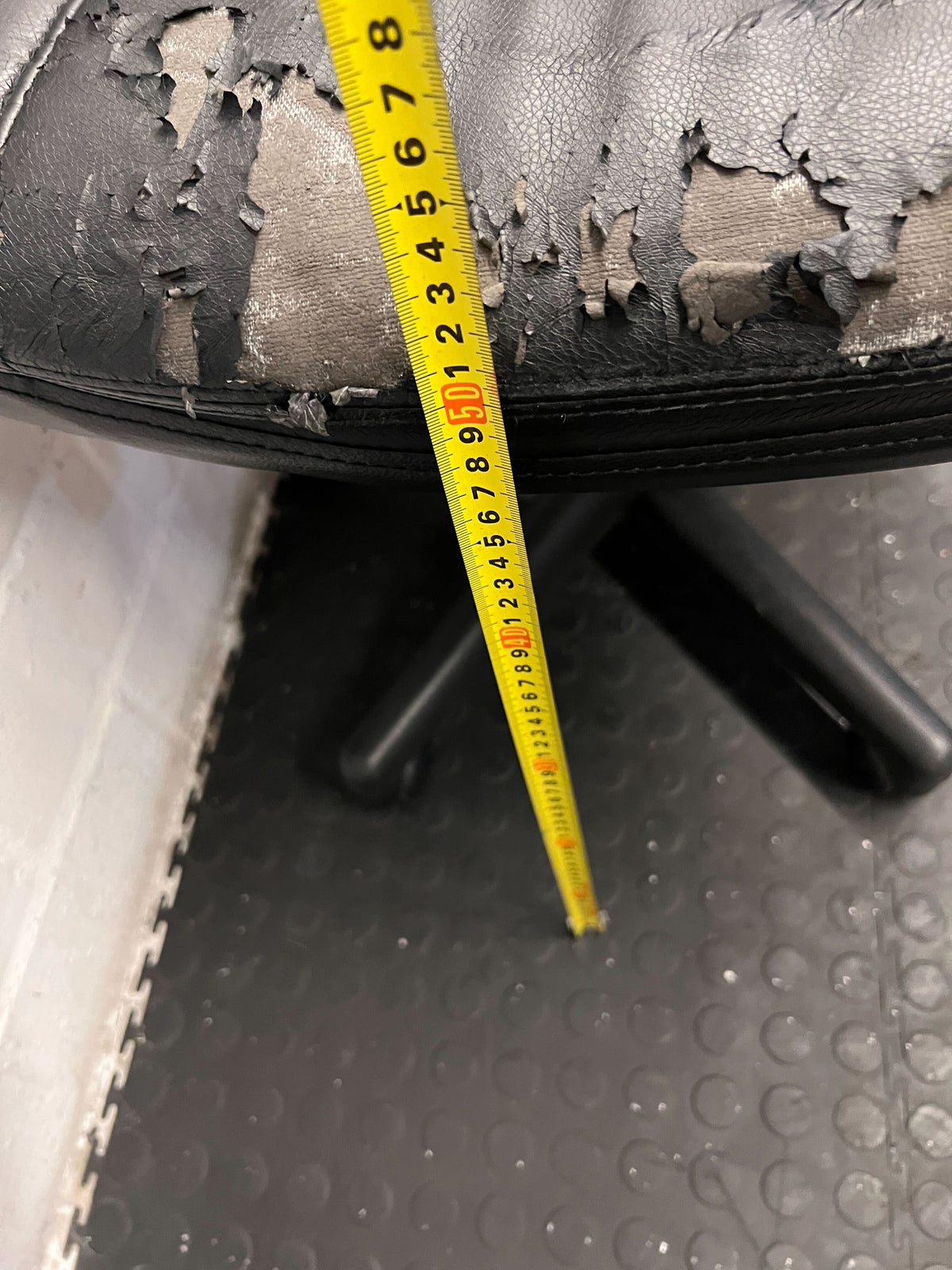 Black Leather Office Chair with Minor Wear and Tear