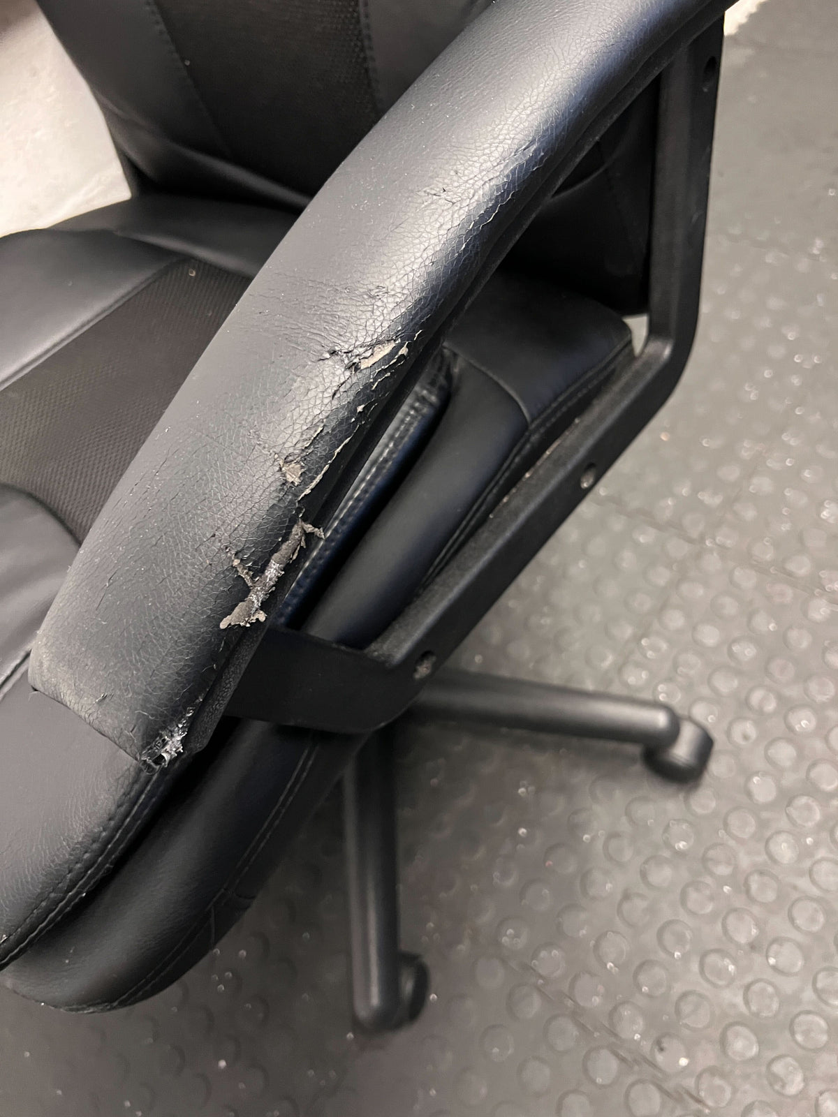 Black Leather Office Chair with Minor Wear and Tear