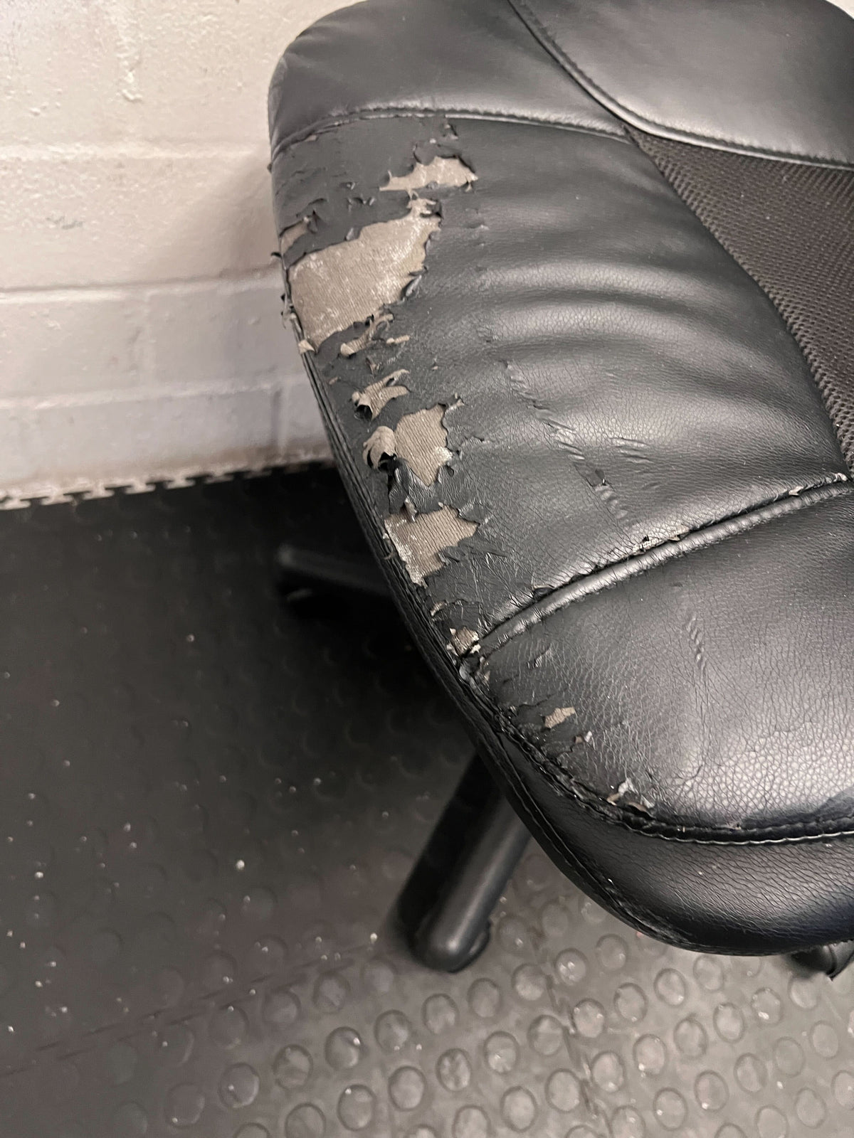 Black Leather Office Chair with Minor Wear and Tear