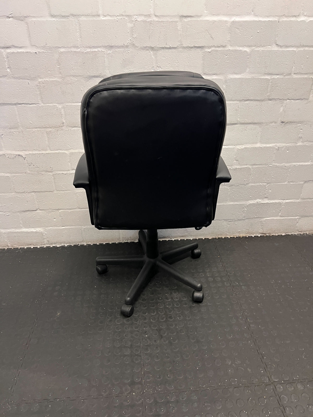 Black Leather Office Chair with Minor Wear and Tear