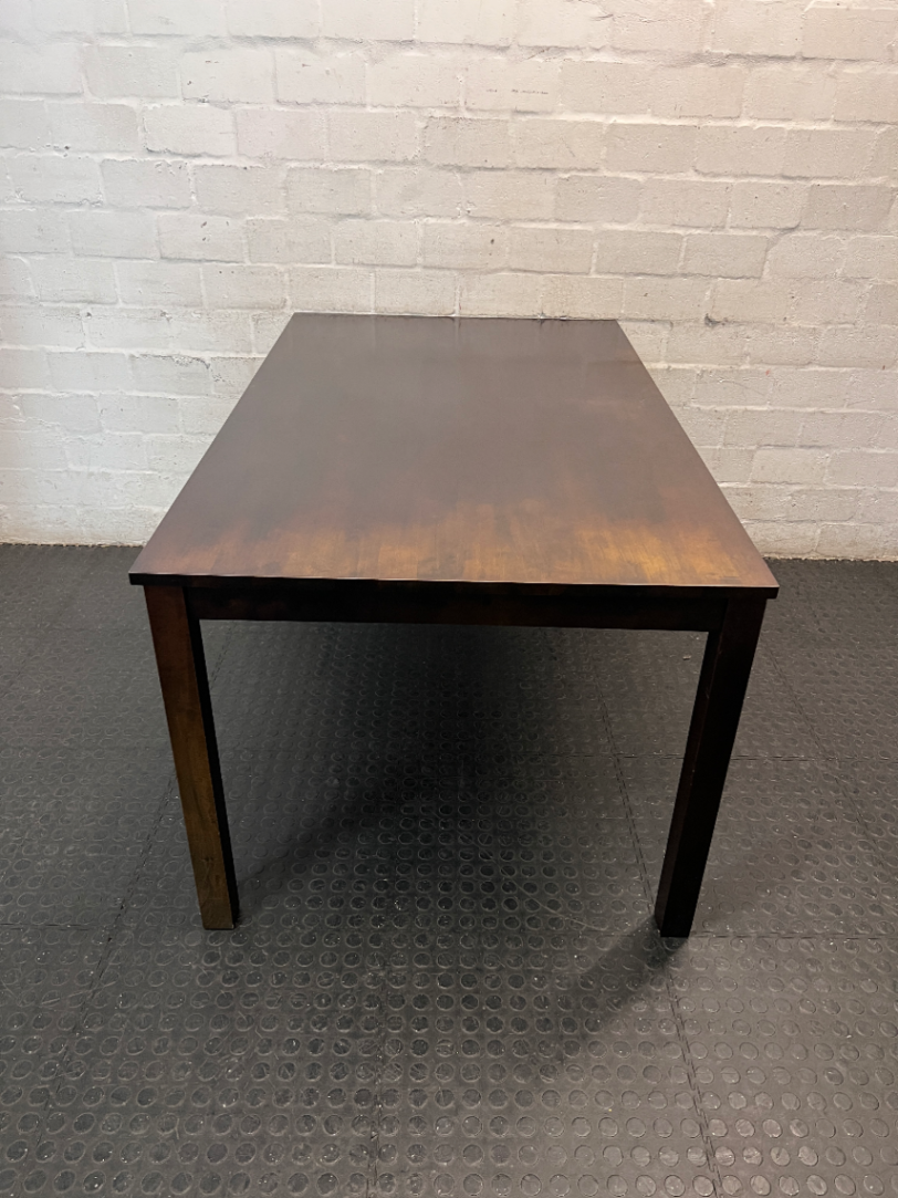 Classic Rectangular Wood-Tone Dining Table — Visible Wear and Surface Discolouration