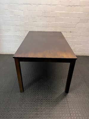 Classic Rectangular Wood-Tone Dining Table — Visible Wear and Surface Discolouration