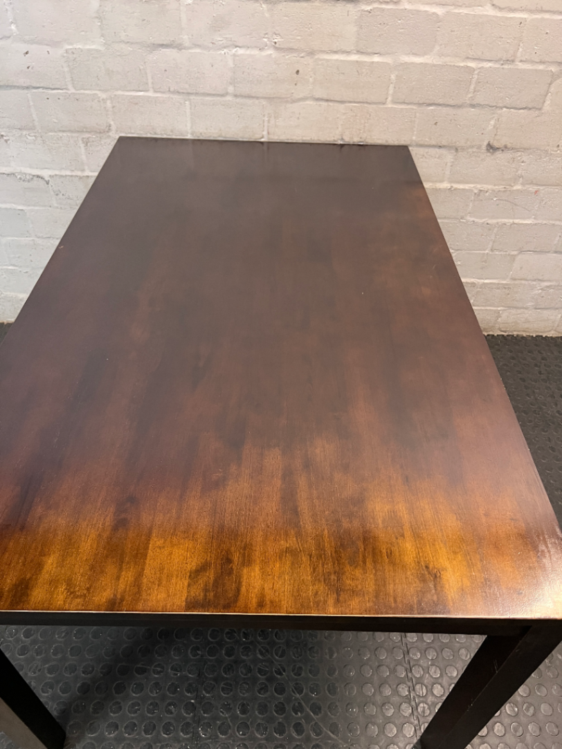 Classic Rectangular Wood-Tone Dining Table — Visible Wear and Surface Discolouration
