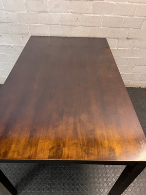 Classic Rectangular Wood-Tone Dining Table — Visible Wear and Surface Discolouration
