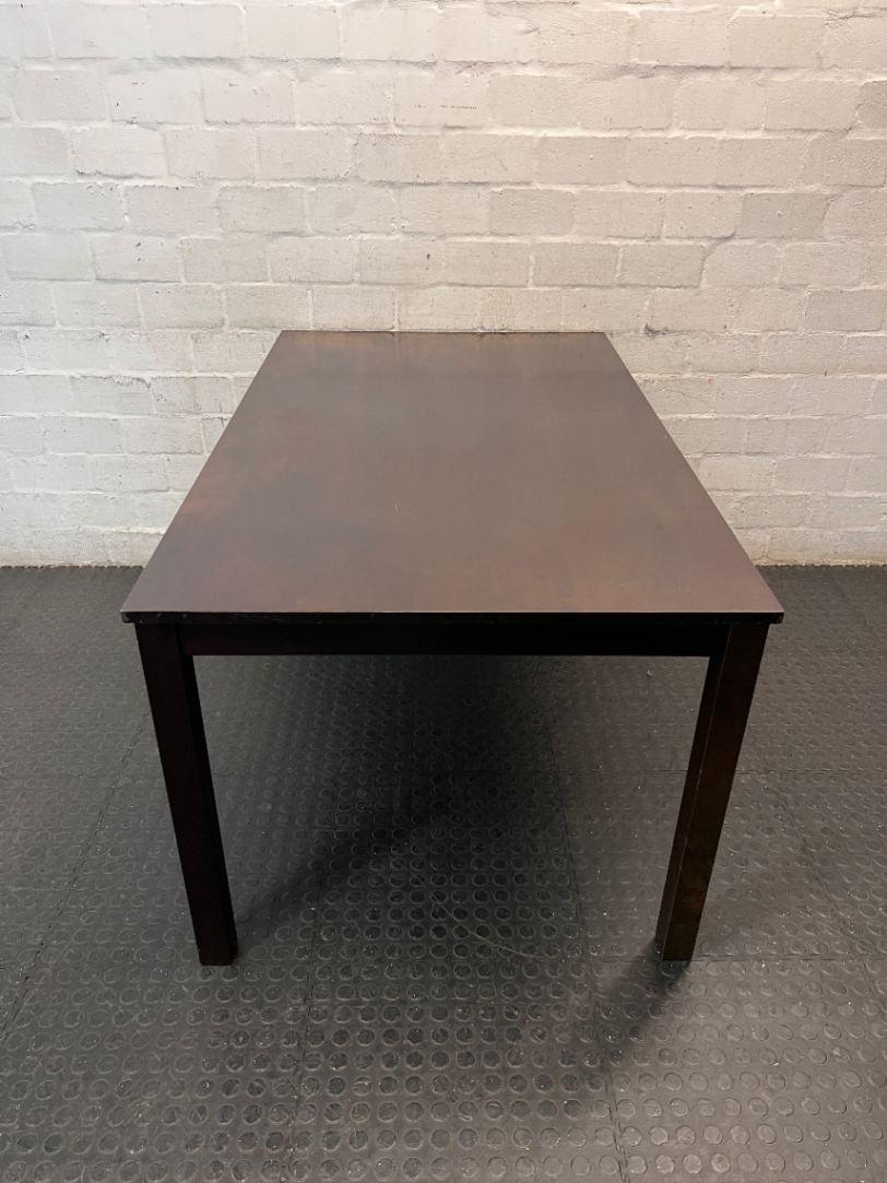 Classic Rectangular Wood-Tone Dining Table — Visible Wear and Surface Discolouration