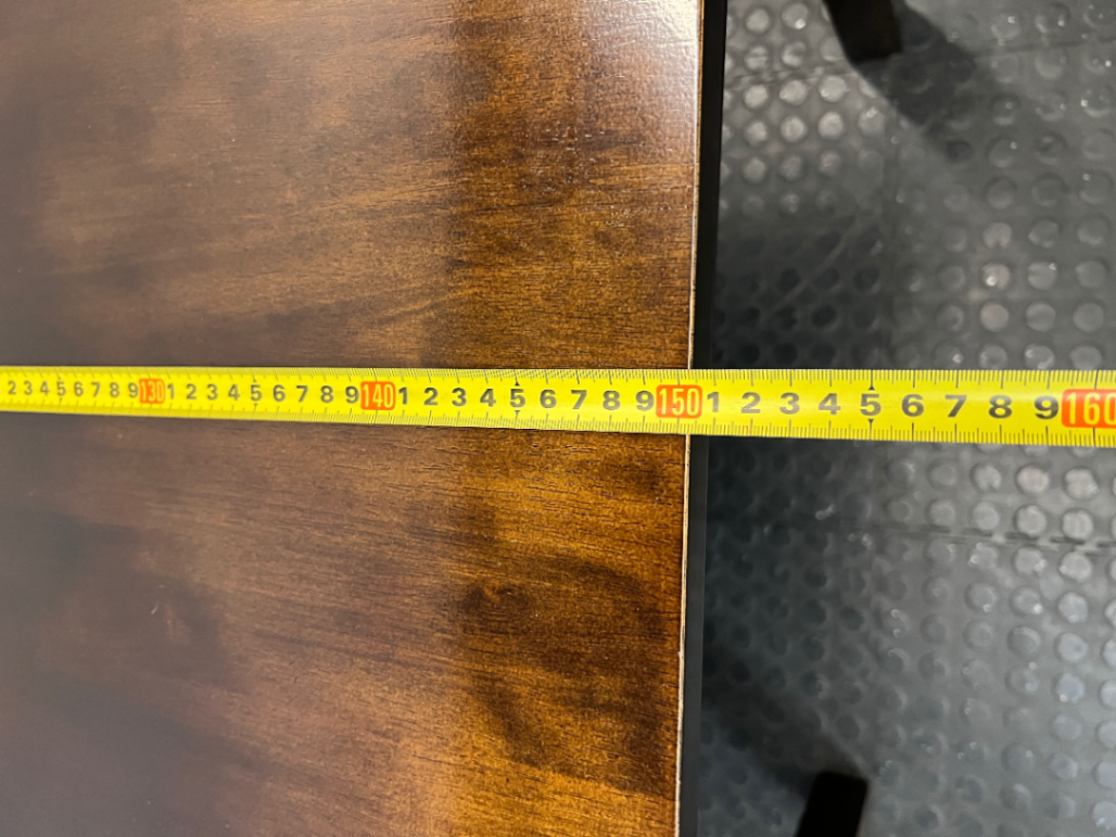 Classic Rectangular Wood-Tone Dining Table — Visible Wear and Surface Discolouration