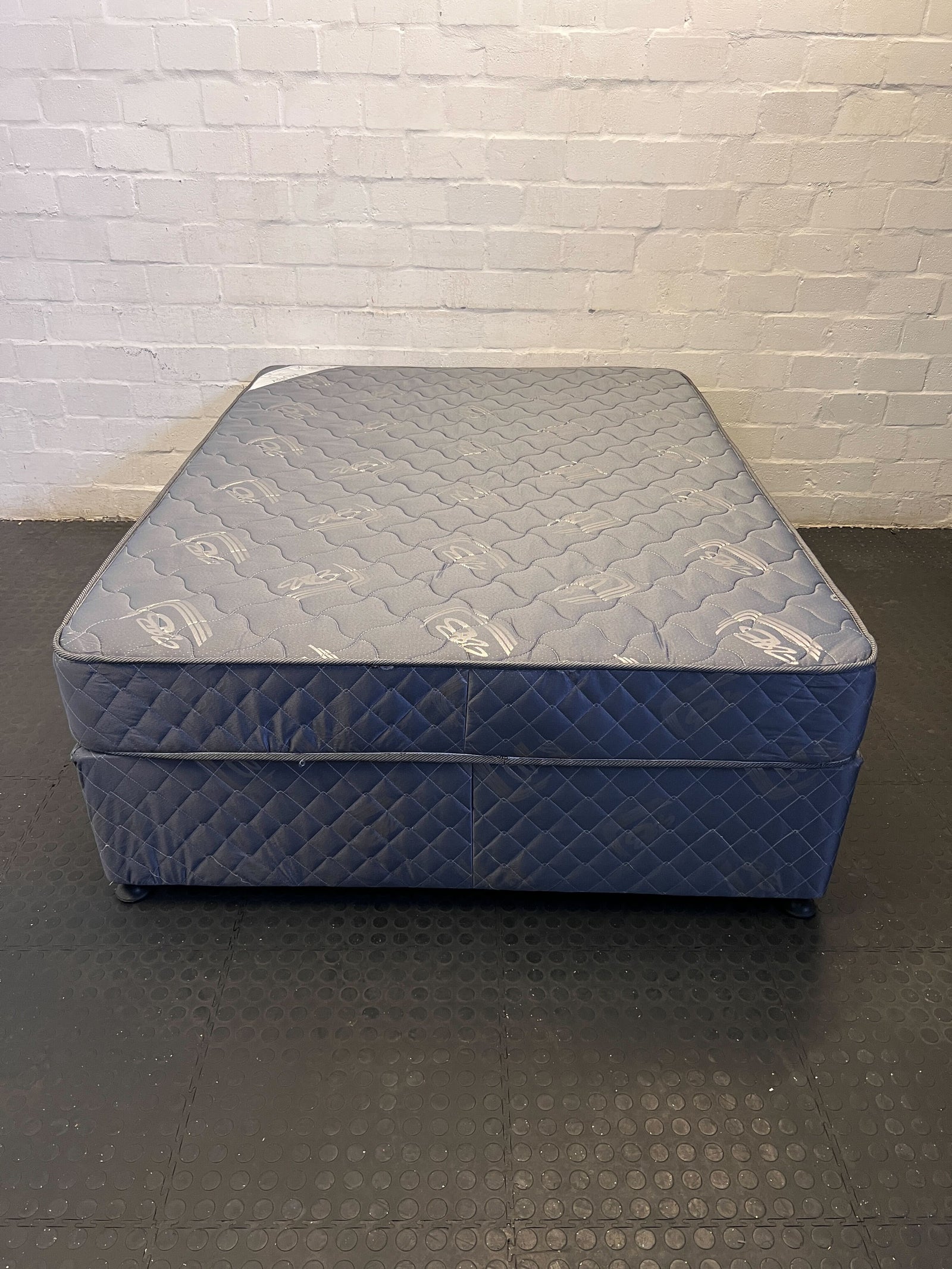 Comfortable Blue Double Bed with Minor Wear