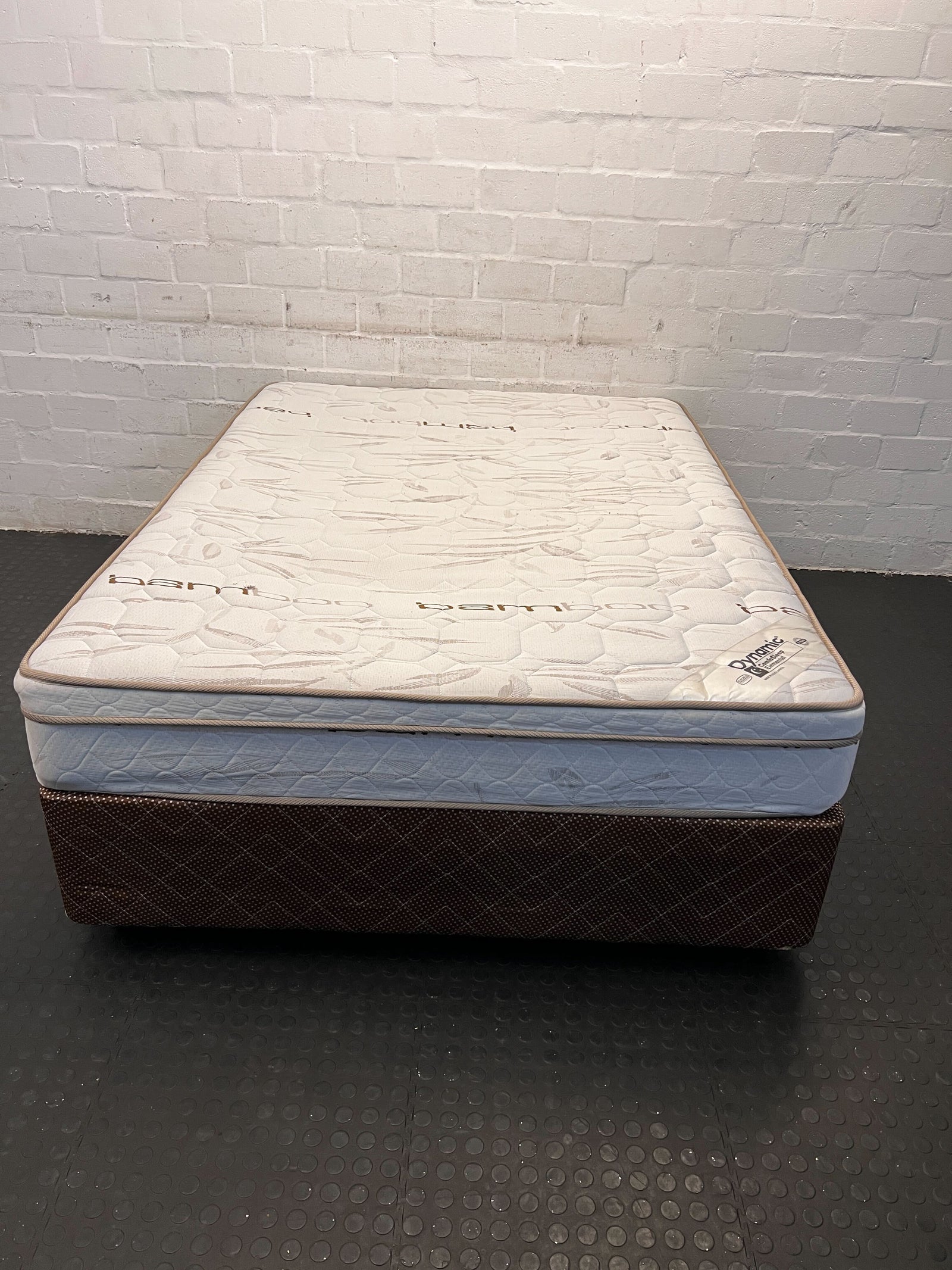 Comfortable Queen-Size Beige Mattress with Minor Wear