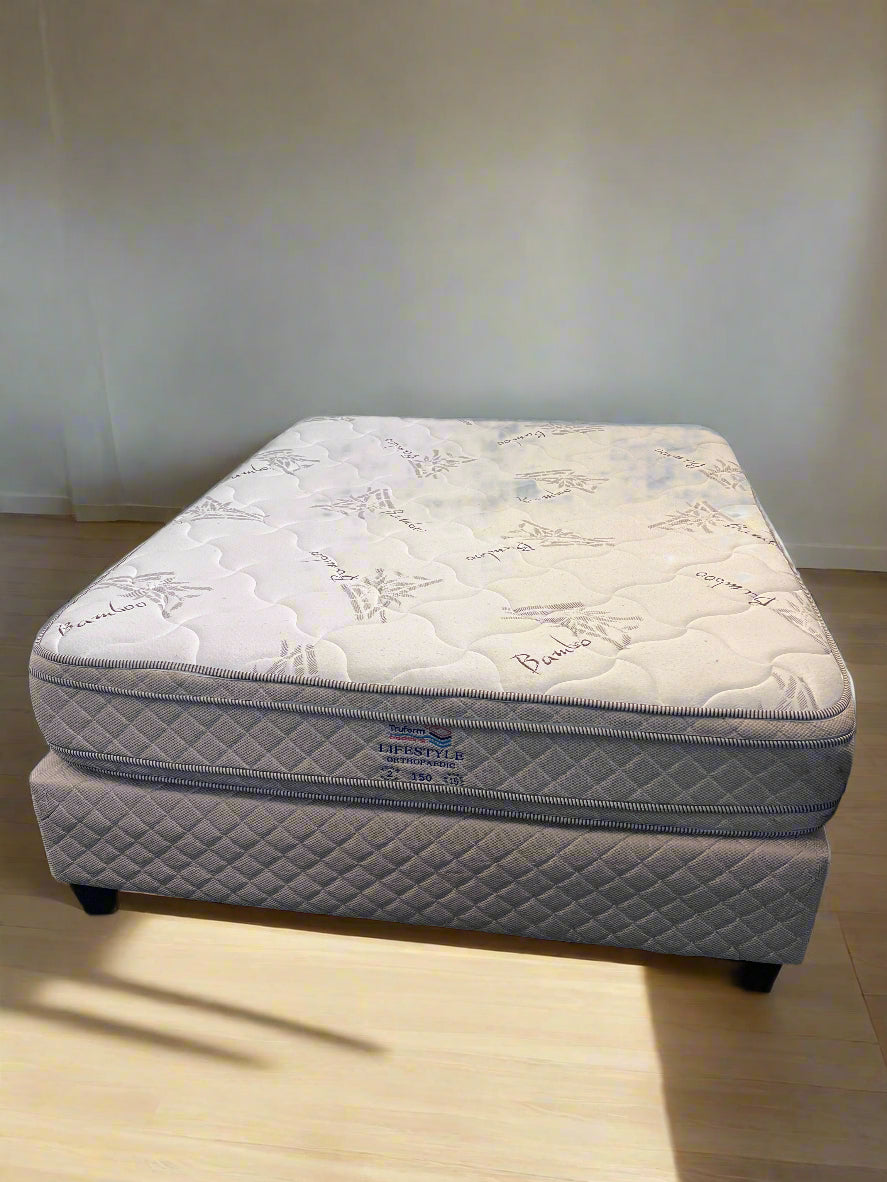 Comfortable Queen-Size Orthopedic Bed in White with Minor Stains