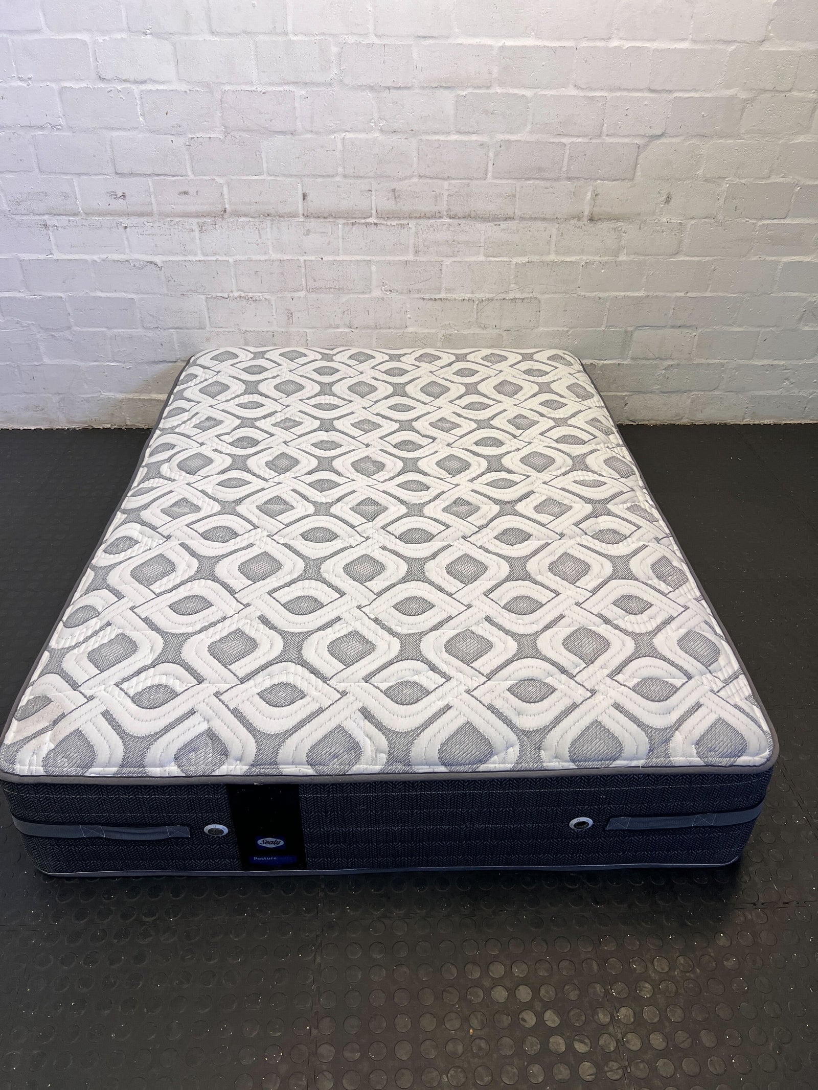 Comfortable Queen-Sized Grey Mattress with Patterned Cover - Good Condition