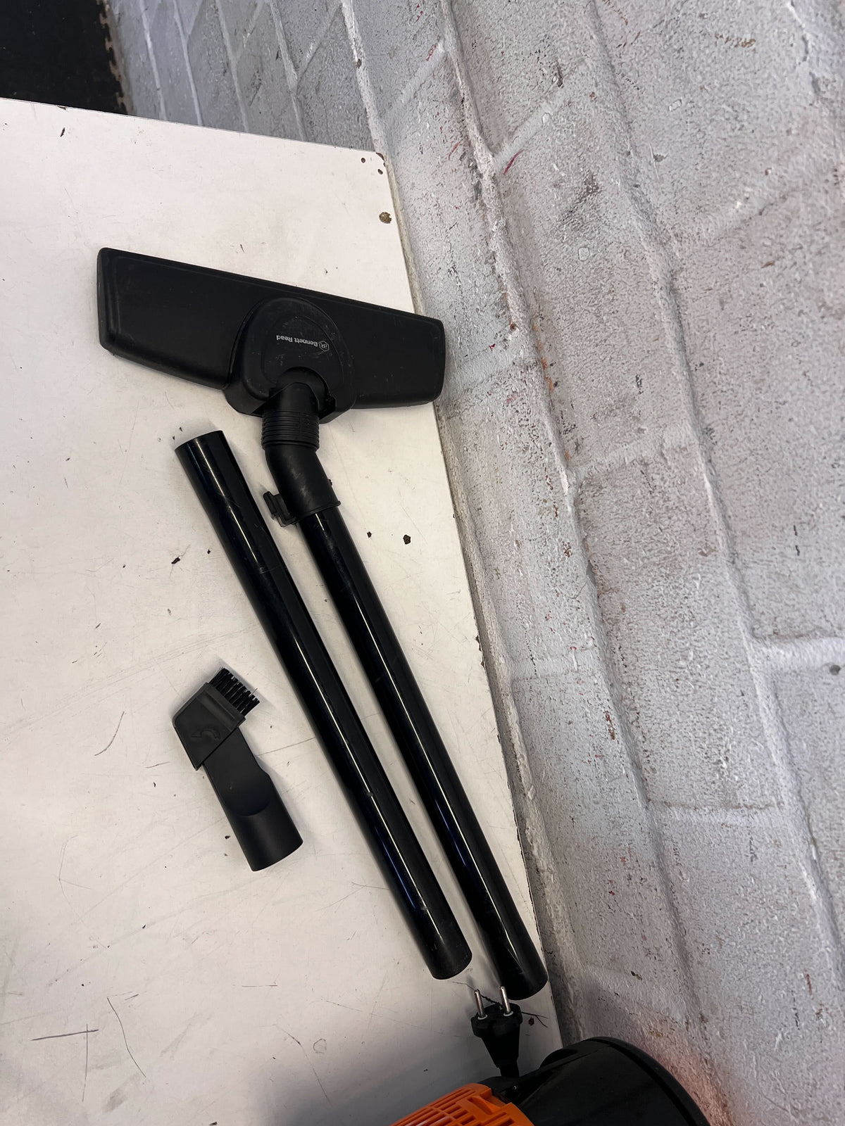 Compact Black and Orange Cylinder Vacuum Cleaner – Good Condition