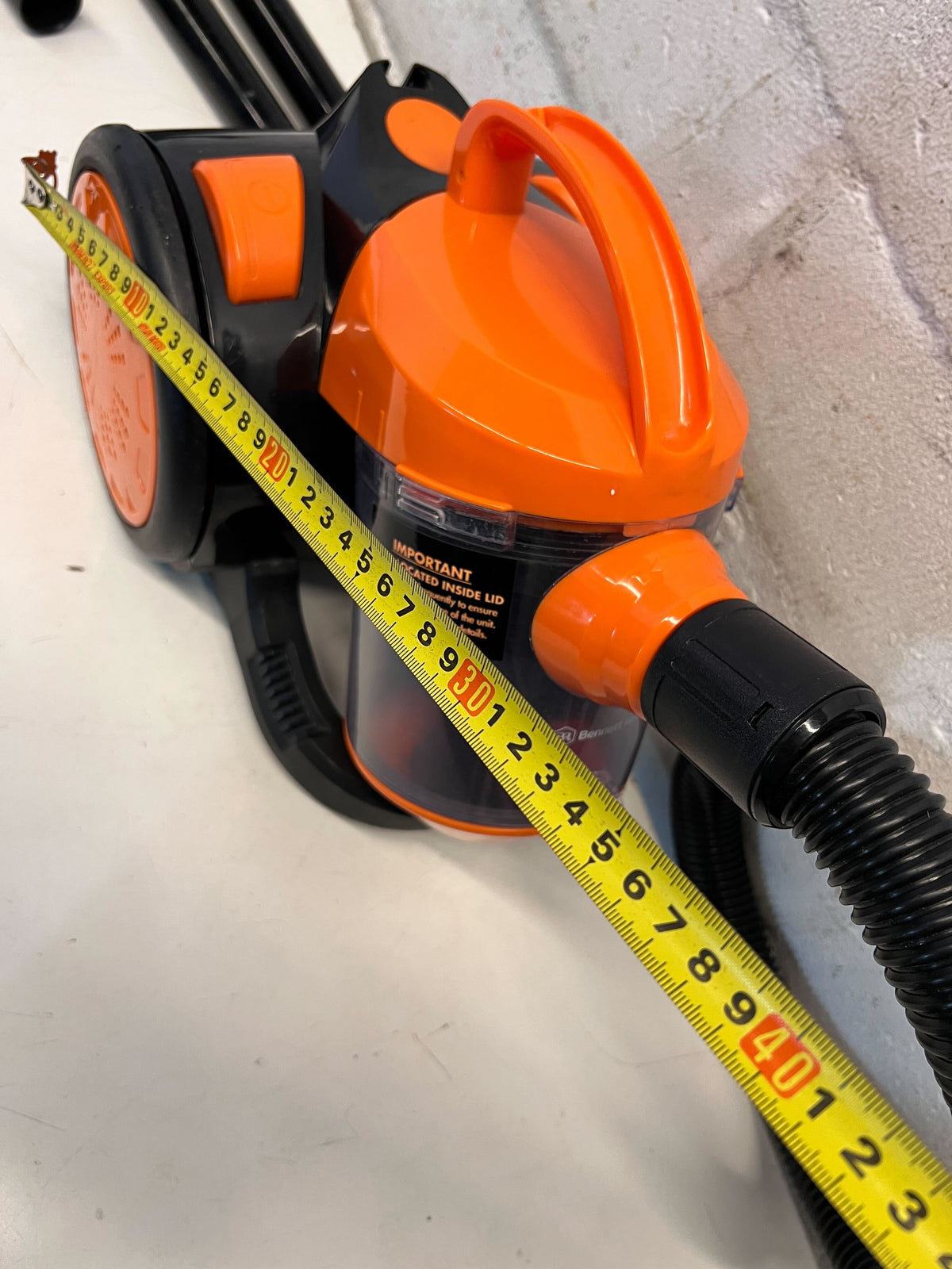 Compact Black and Orange Cylinder Vacuum Cleaner – Good Condition