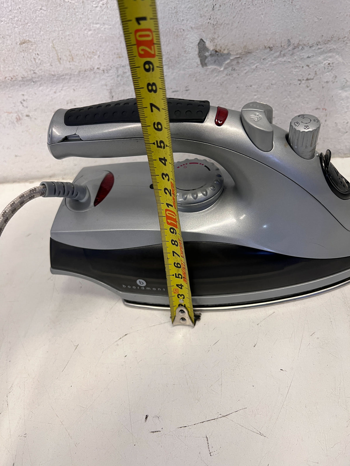 Compact Grey Steam Iron with Minor Wear – Not in Working Condition