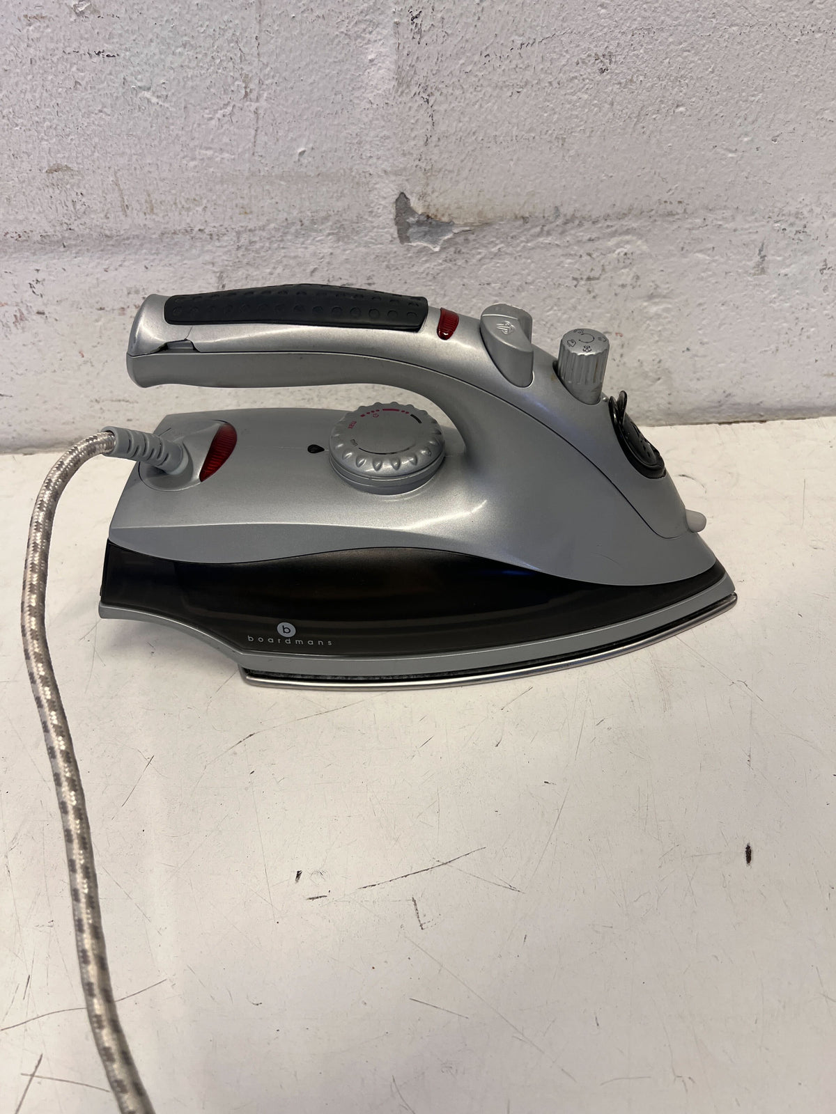 Compact Grey Steam Iron with Minor Wear – Not in Working Condition