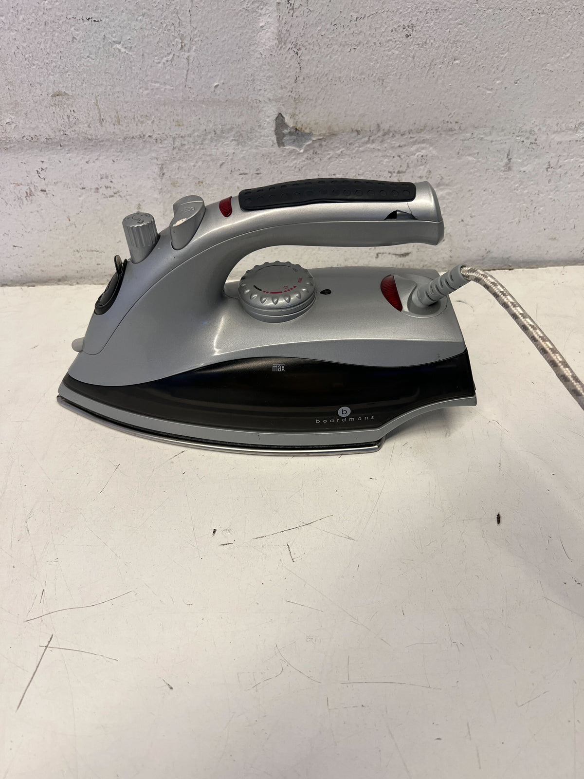 Compact Grey Steam Iron with Minor Wear – Not in Working Condition