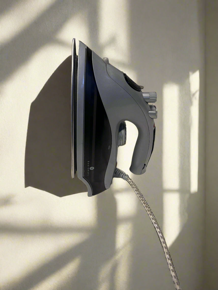 Compact Grey Steam Iron with Minor Wear – Not in Working Condition