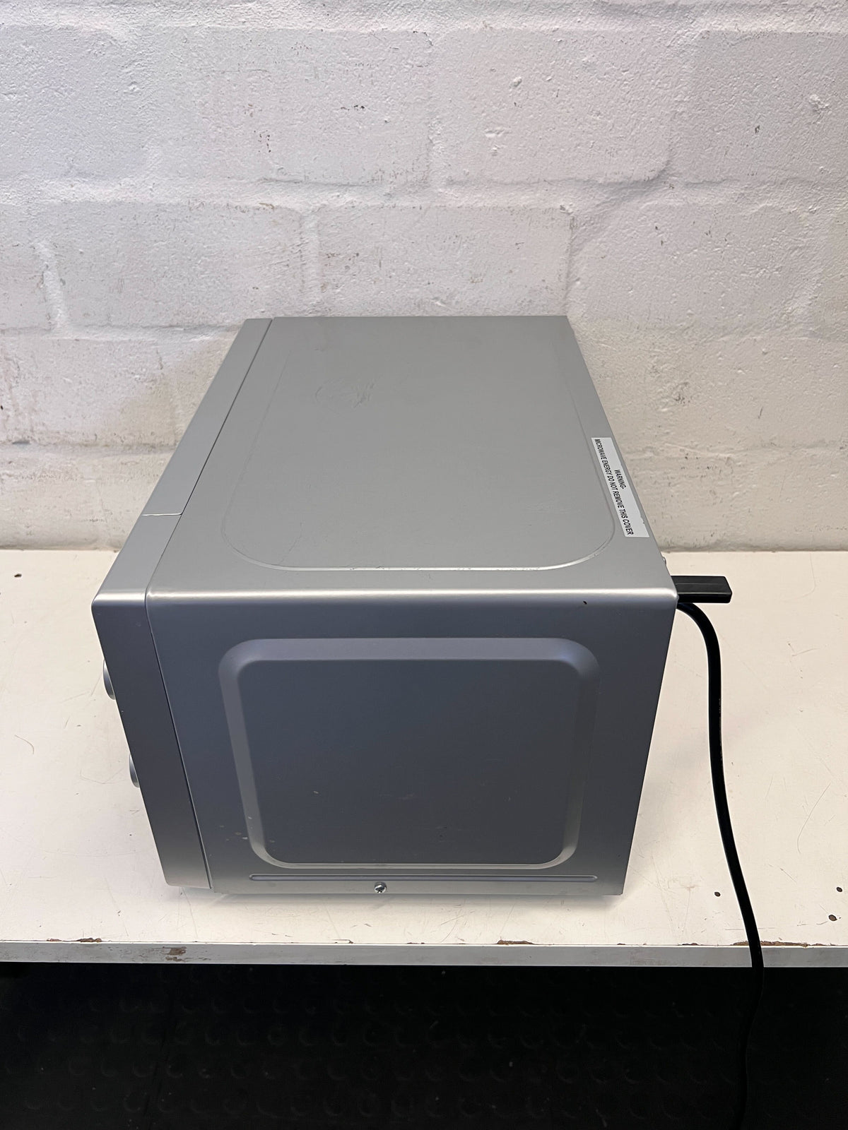 Compact Silver Univa Microwave - Excellent Condition with Minor Scratches - REDUCED