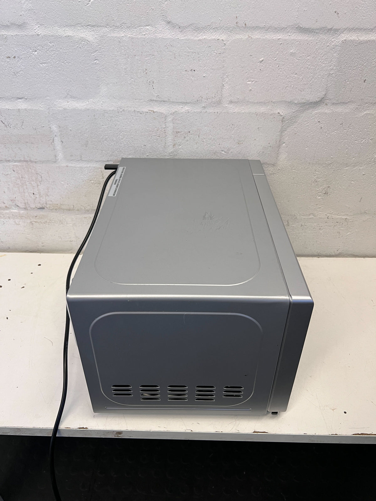 Compact Silver Univa Microwave - Excellent Condition with Minor Scratches - REDUCED