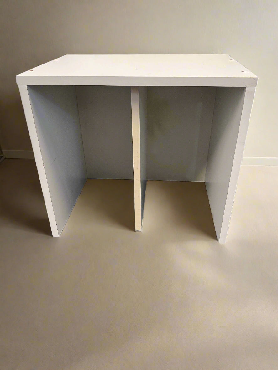 White minimalist desk against a plain wall