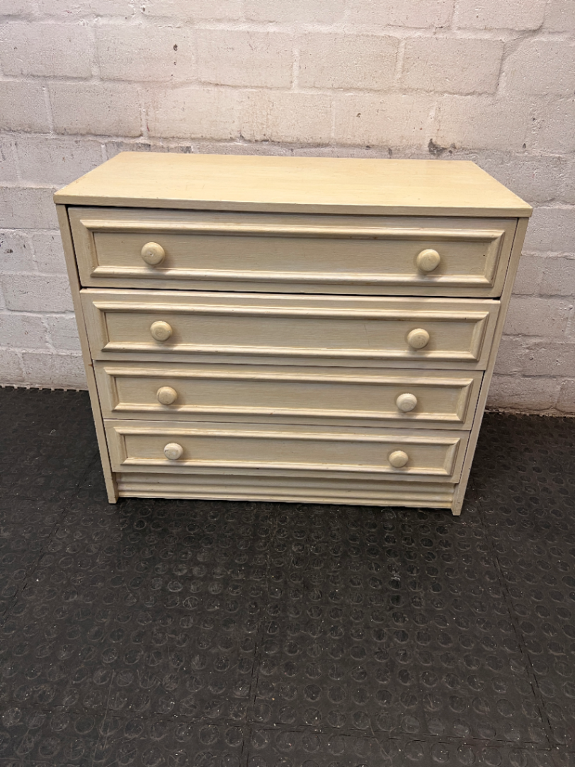 Cream Four-Drawer Chest with Moulded Panelling — Fair Condition with Visible Wear