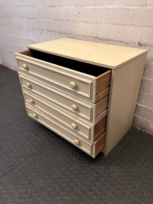 Cream Four-Drawer Chest with Moulded Panelling — Fair Condition with Visible Wear