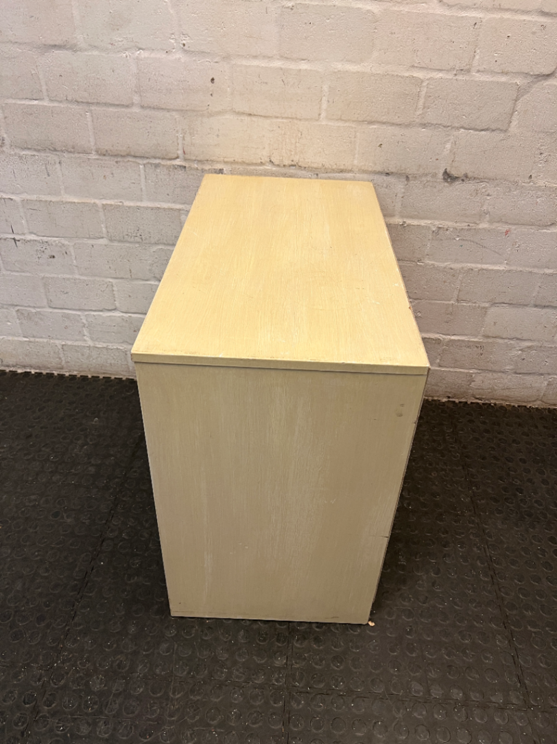 Cream Four-Drawer Chest with Moulded Panelling — Fair Condition with Visible Wear
