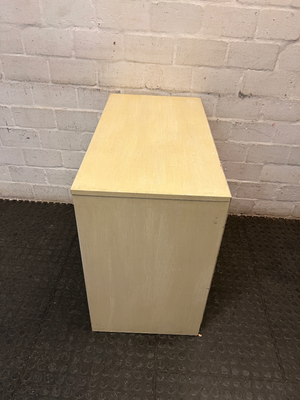 Cream Four-Drawer Chest with Moulded Panelling — Fair Condition with Visible Wear