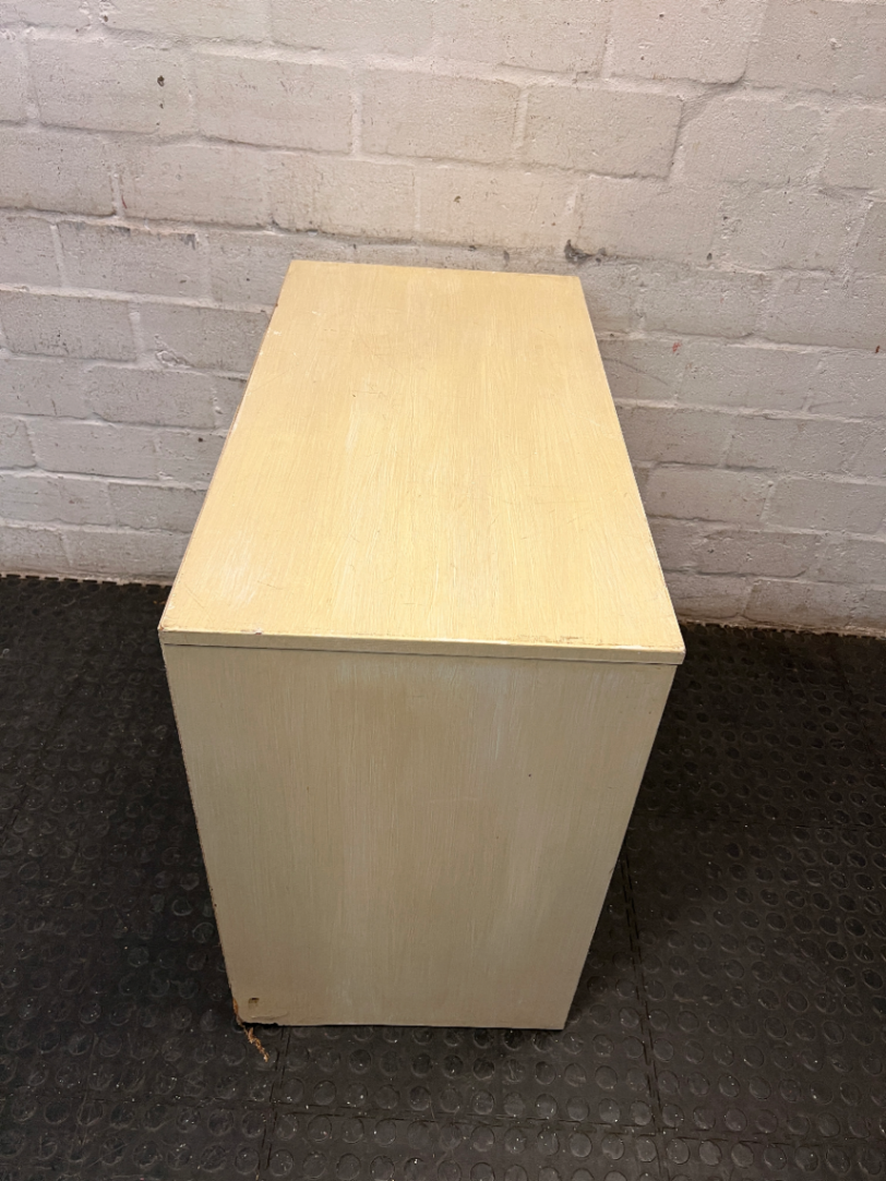 Cream Four-Drawer Chest with Moulded Panelling — Fair Condition with Visible Wear