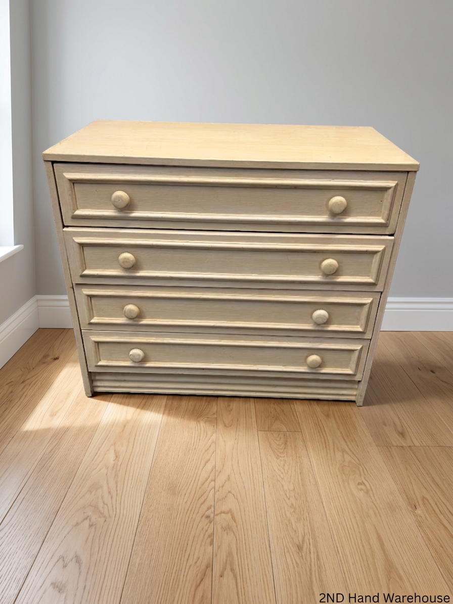 Cream Four-Drawer Chest with Moulded Panelling — Fair Condition with Visible Wear